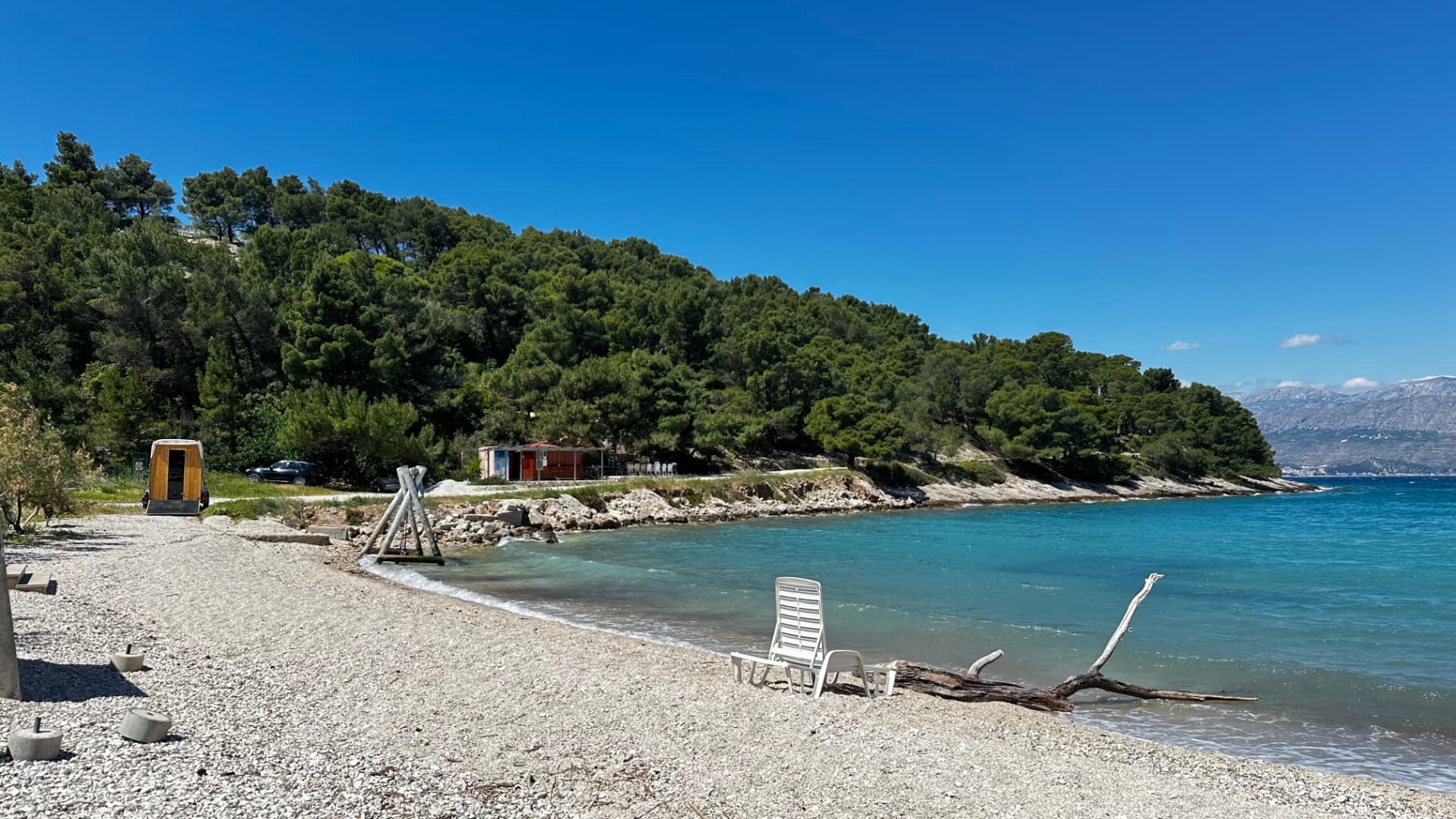 Adriatic bay showroom with a mobile sauna on the pebble shore
